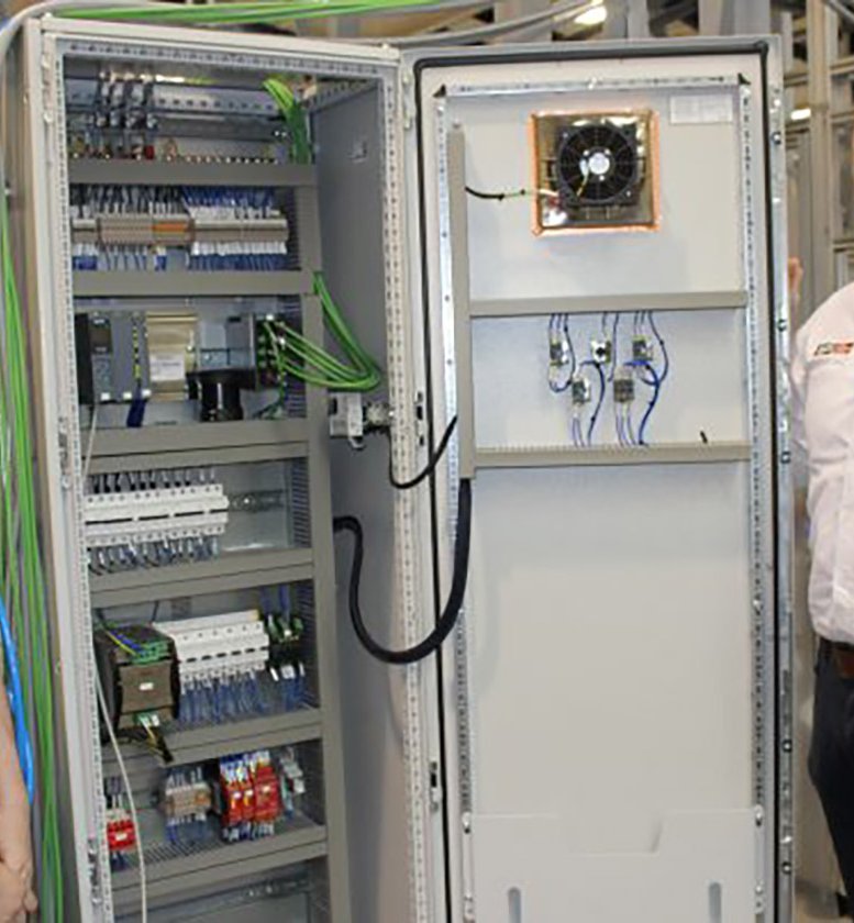 adi Apprentice with Worker in front of Network Cabinet